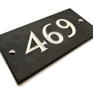 3 digit hand engraved slate house number with deep V cut engraving.